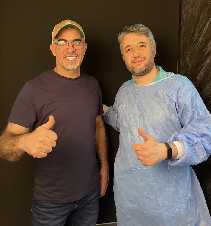 Prof. Dr. Orçun Toptaş with a patient